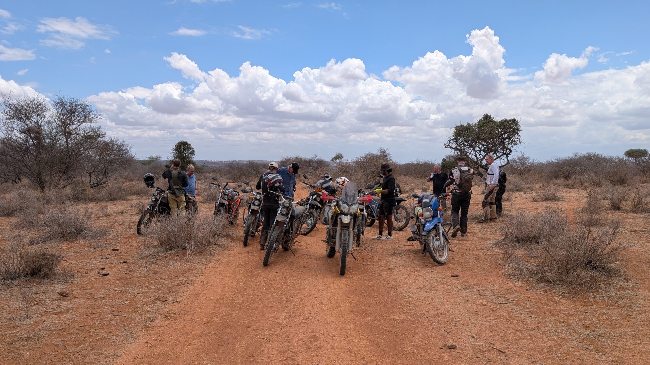 Riders on a dirt track in the Kenyan highlands